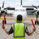 How is the Work Environment for an Airfield Operations Specialist?