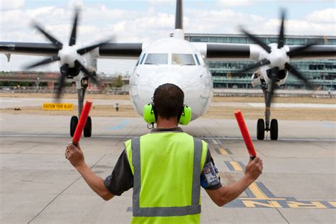 How is the Work Environment for an Airfield Operations Specialist?